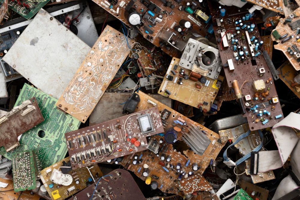 A stack of electronic components and devices, showcasing e-waste for a junk removal service located in Jacksonville, FL.